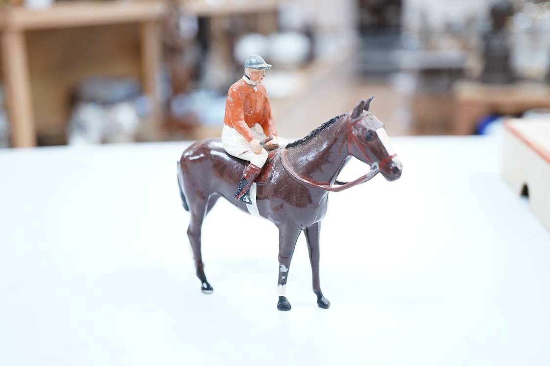 Two boxed Britains Racing Colours of Famous Owners series lead mounted figures; Miss Dorothy Paget - rider in yellow-striped blue jersey on a grey horse, and Msr. M. Boussac - rider in orange jersey on a dark brown horse